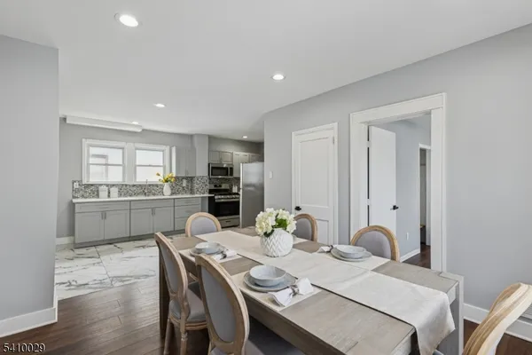 a dining room with furniture and window