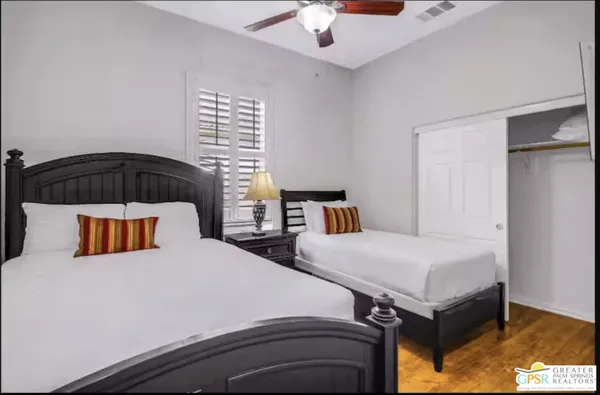 a spacious bathroom with a granite countertop sink mirror and shower