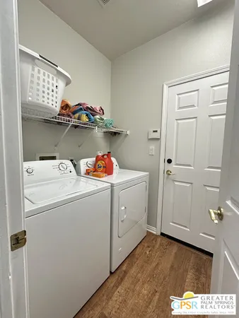 a view of a room with furniture and air hockey table