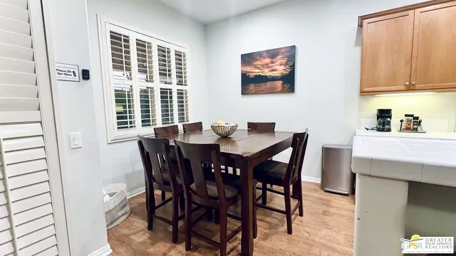 a bed room with furniture and a flat screen tv