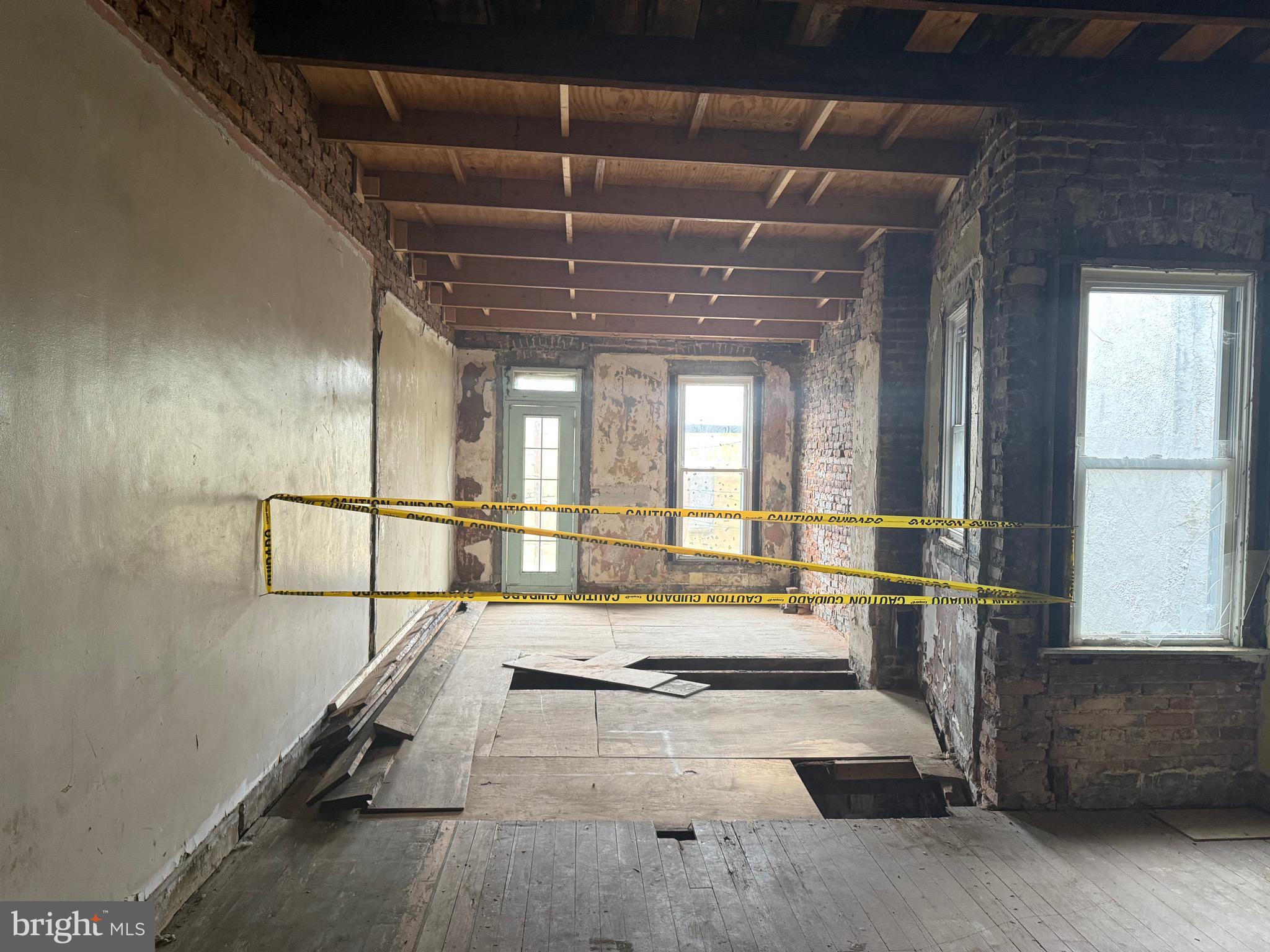 2754 Riggs Avenue Baltimore, MD 21216 - Photo 13 of 13 a spacious bathroom with a tub and window