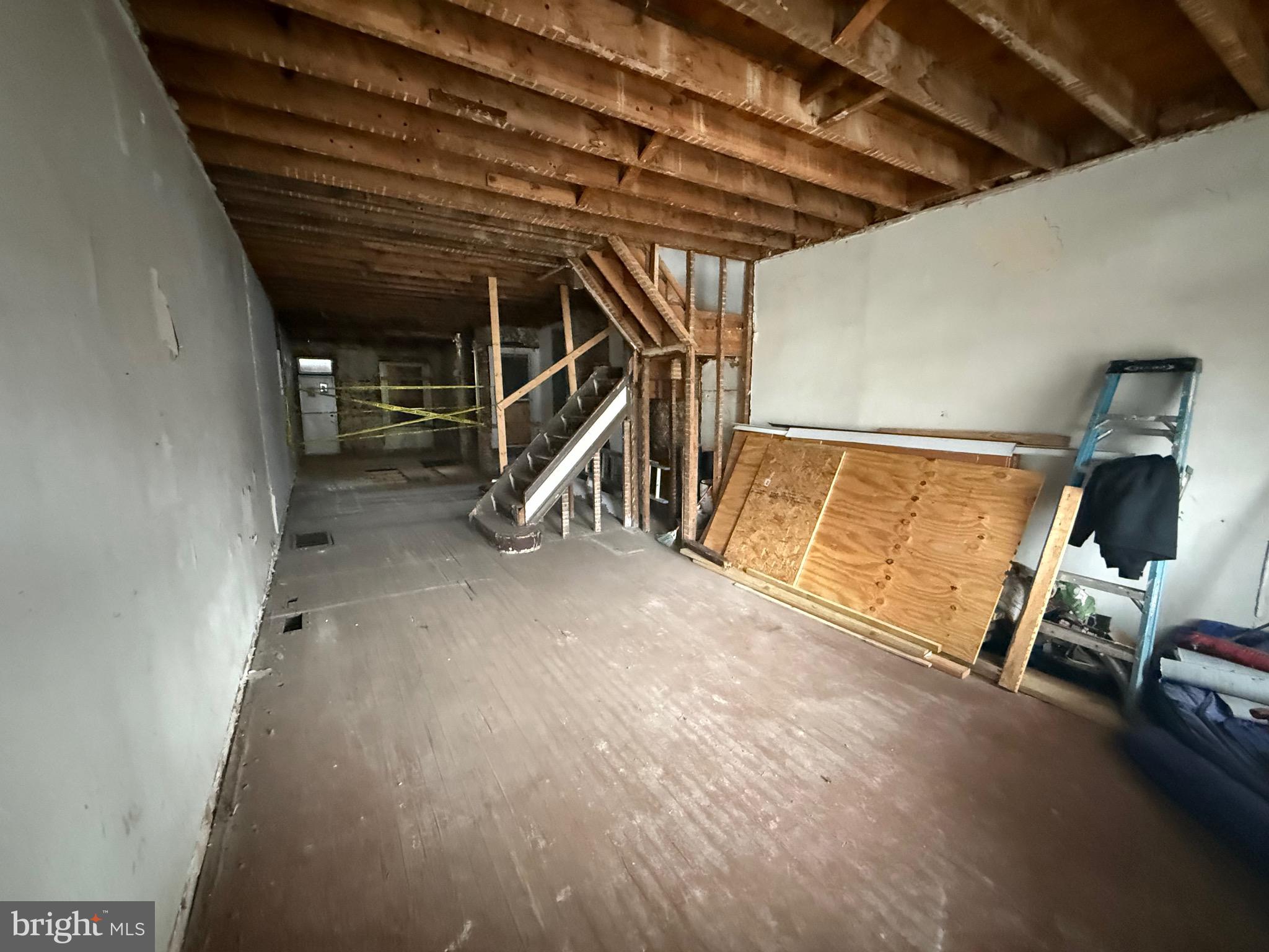 2754 Riggs Avenue Baltimore, MD 21216 - Photo 6 of 13 a view of an empty room with wooden floor