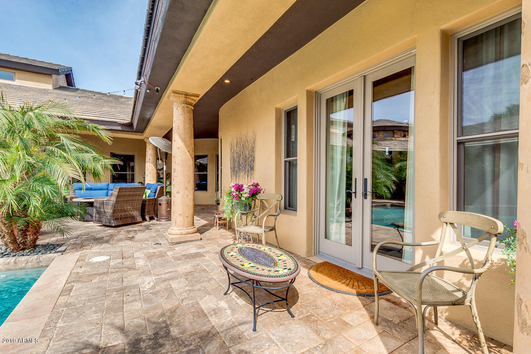 711 West Germann Road Chandler, AZ 85286 - Photo 54 of 74 a view of a patio with couple of chairs and a potted plant
