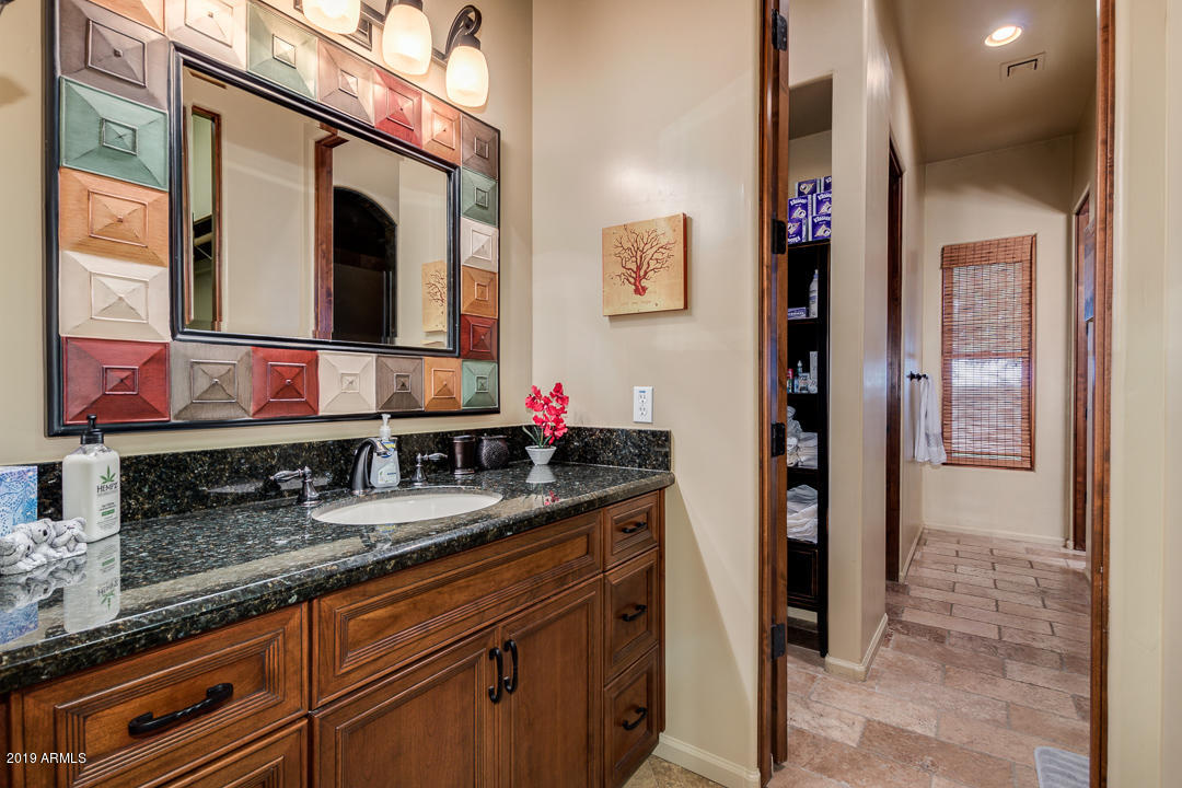 711 West Germann Road Chandler, AZ 85286 - Photo 58 of 74 a bathroom with a granite countertop double vanity sink and a mirror