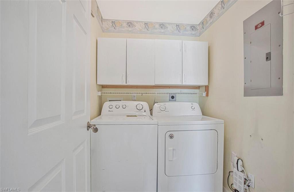 6605 Huntington Lakes Circle, Unit 103 Naples, FL 34119 - Photo 23 of 30 a utility room with dryer and washer