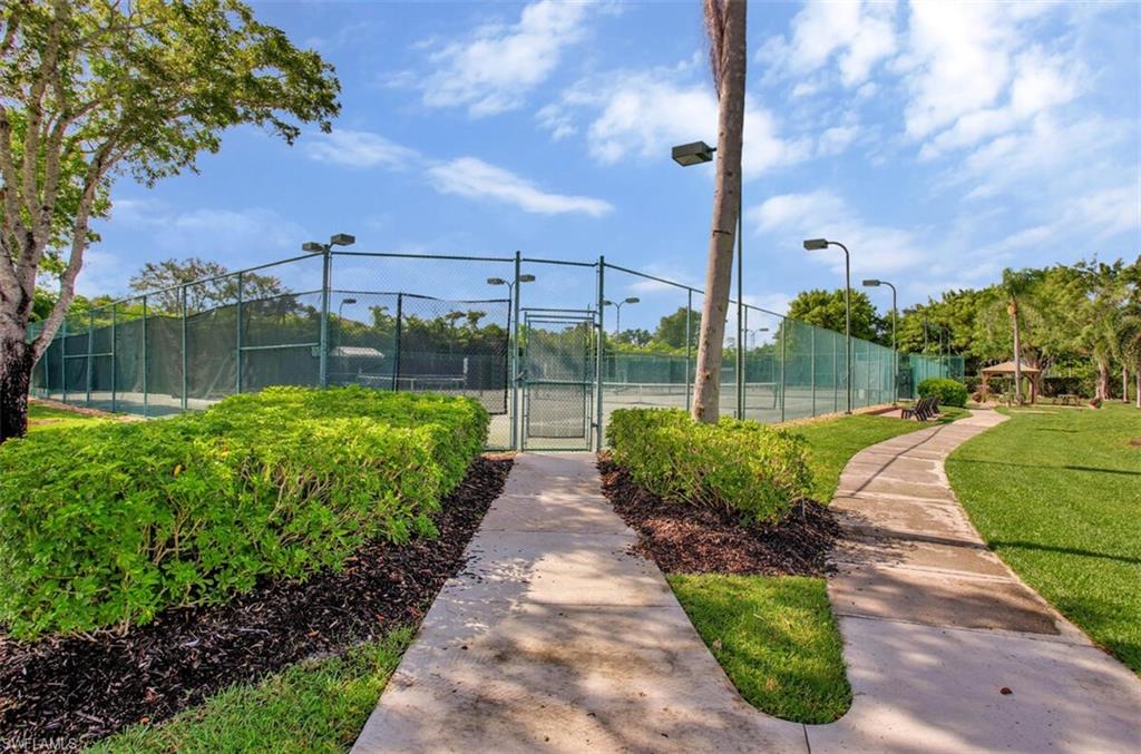 6605 Huntington Lakes Circle, Unit 103 Naples, FL 34119 - Photo 27 of 30 a view of a park with a large trees