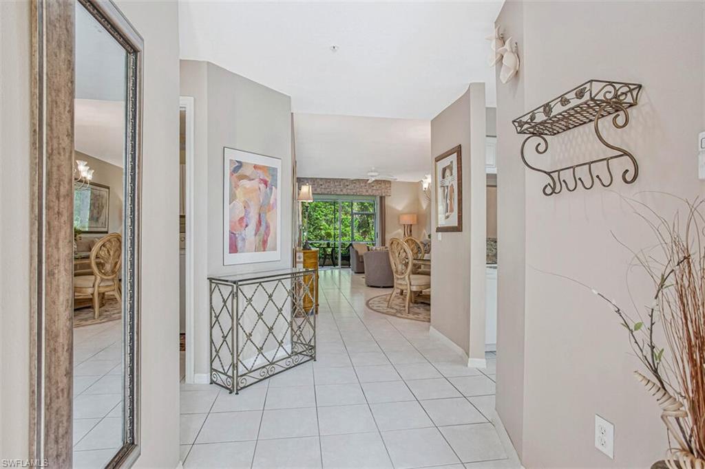 6605 Huntington Lakes Circle, Unit 103 Naples, FL 34119 - Photo 3 of 30 a view of a entryway with furniture