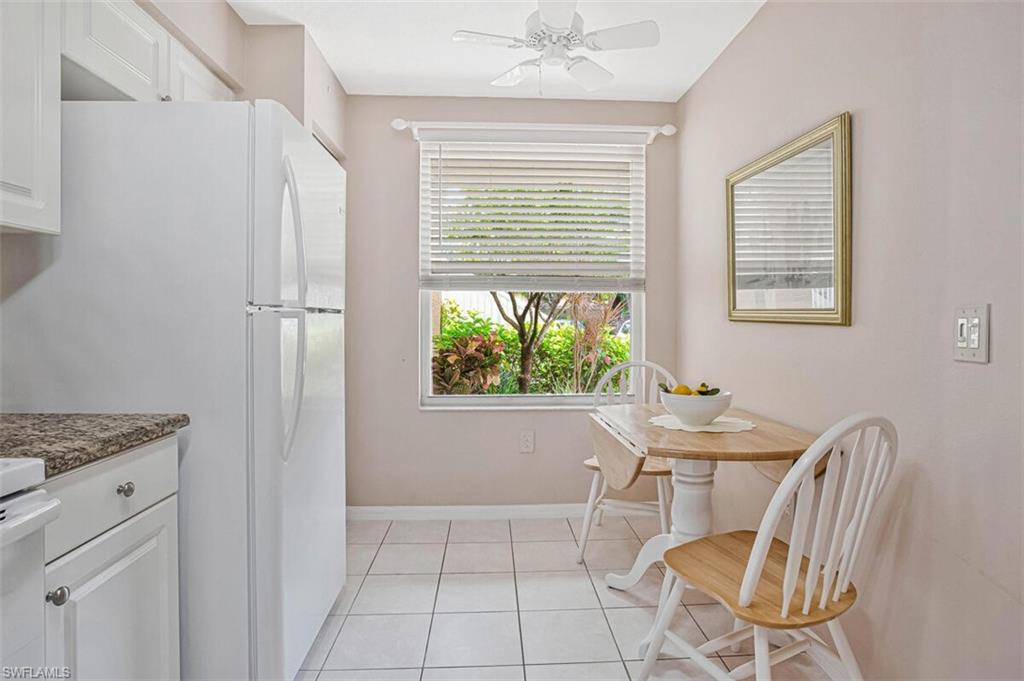 6605 Huntington Lakes Circle, Unit 103 Naples, FL 34119 - Photo 7 of 30 a view of a workspace with furniture and a window