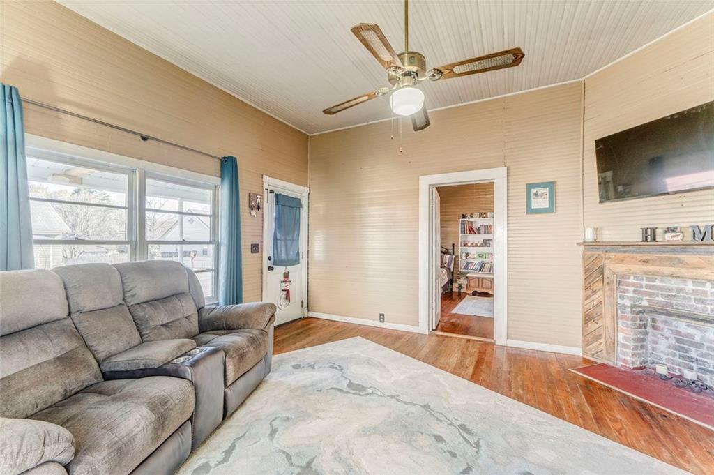 30 Oak Street Aragon, GA 30104 - Photo 13 of 38 a living room with furniture a flat screen tv and a large window