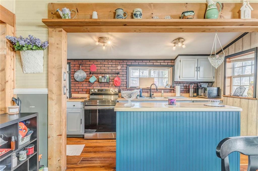 30 Oak Street Aragon, GA 30104 - Photo 16 of 38 a kitchen with stainless steel appliances granite countertop a sink and cabinets