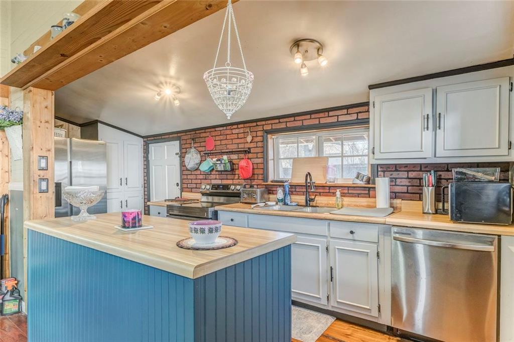 30 Oak Street Aragon, GA 30104 - Photo 19 of 38 a kitchen with a sink cabinets and window