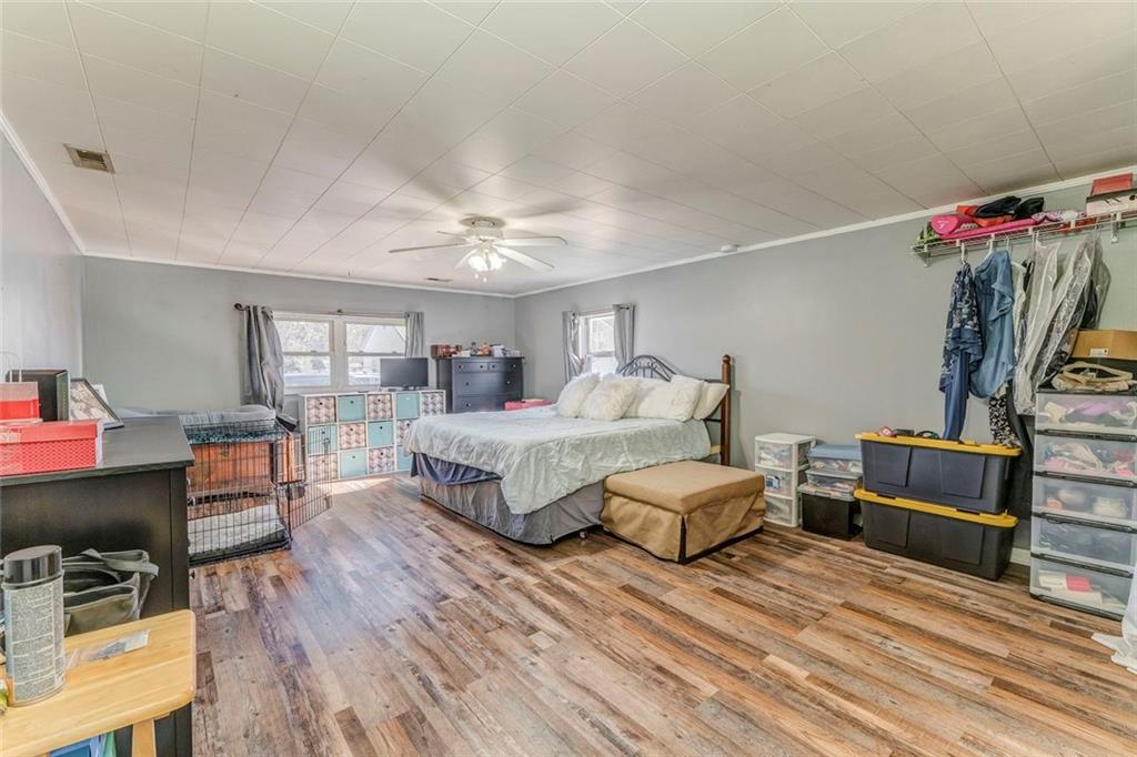 30 Oak Street Aragon, GA 30104 - Photo 27 of 38 a bedroom with furniture and a wooden floor