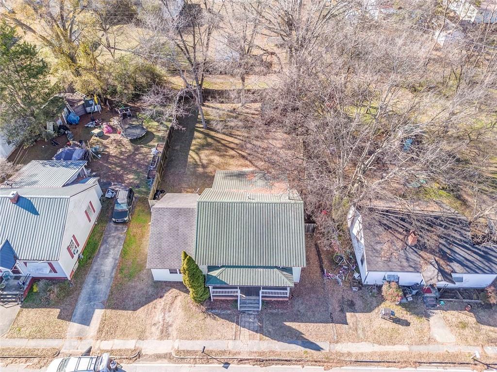 30 Oak Street Aragon, GA 30104 - Photo 7 of 38 a wooden bench sitting in front of a building