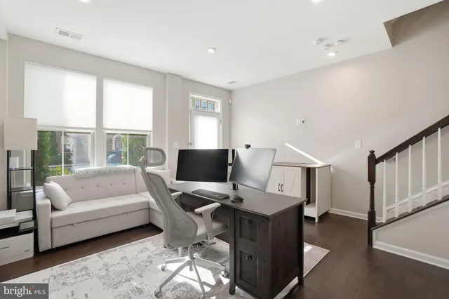 a workspace with furniture and a window