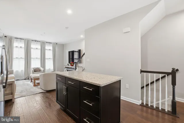 a view with a sink and wooden floor in a room
