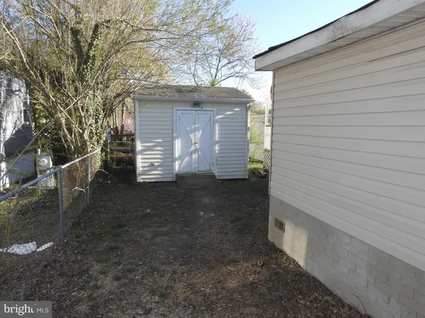a view of backyard with wooden deck