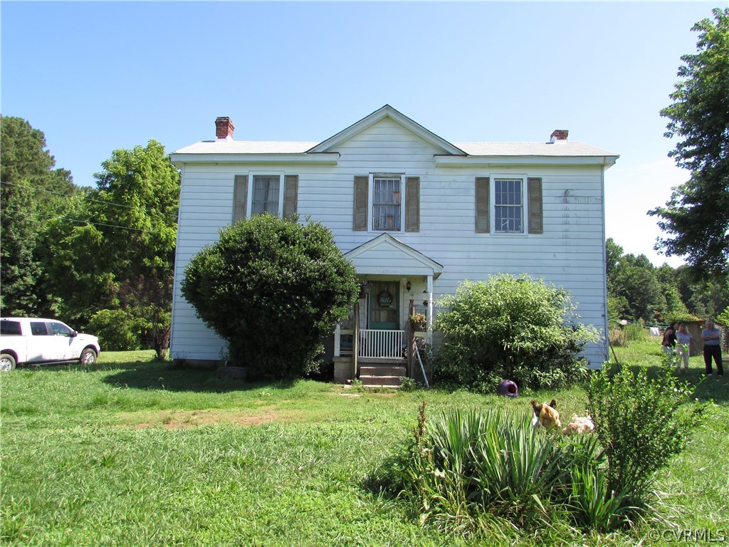 6422 White Oak Road Wilsons, VA 23894 - Photo 1 of 6 a front view of a house with a yard and garage