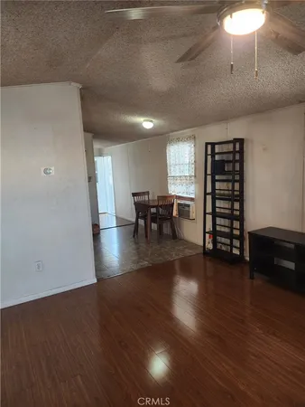 a view of a livingroom with furniture and wooden floor