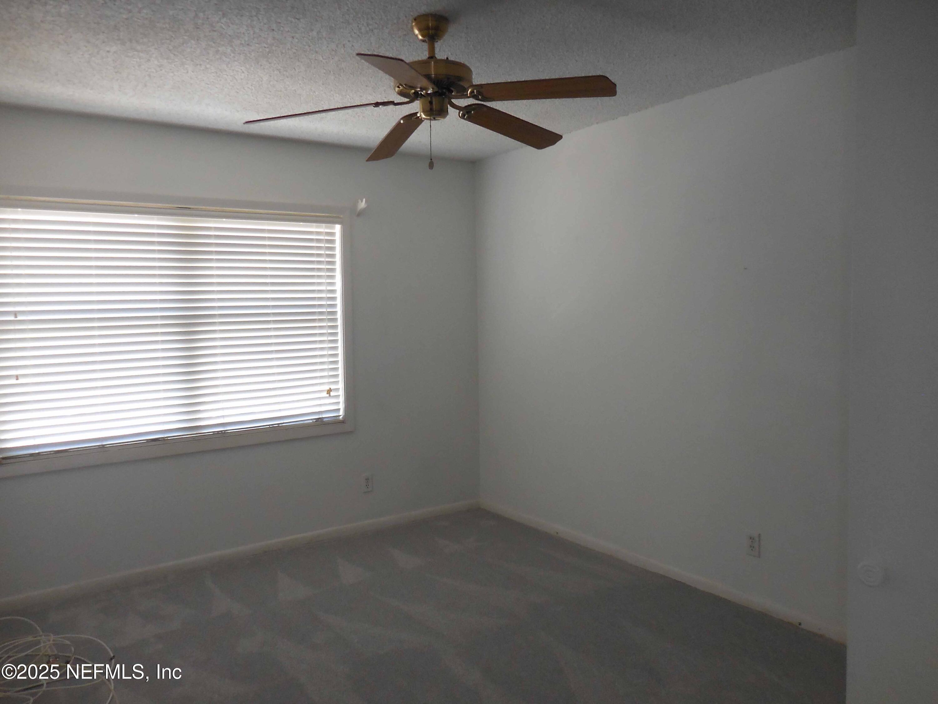 695 A1A North, Unit 23 Ponte Vedra Beach, FL 32082 - Photo 11 of 22 an empty room with a window