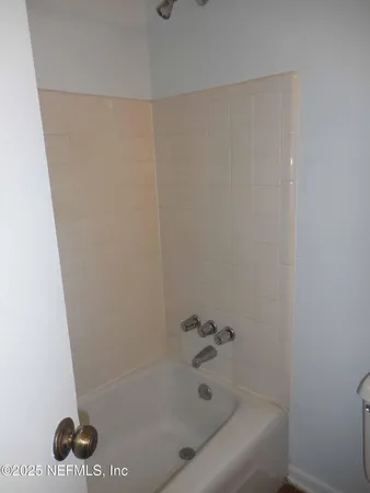 a bathroom with a bathtub