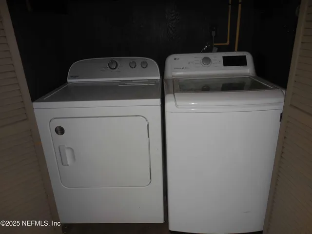 a utility room with dryer and washer