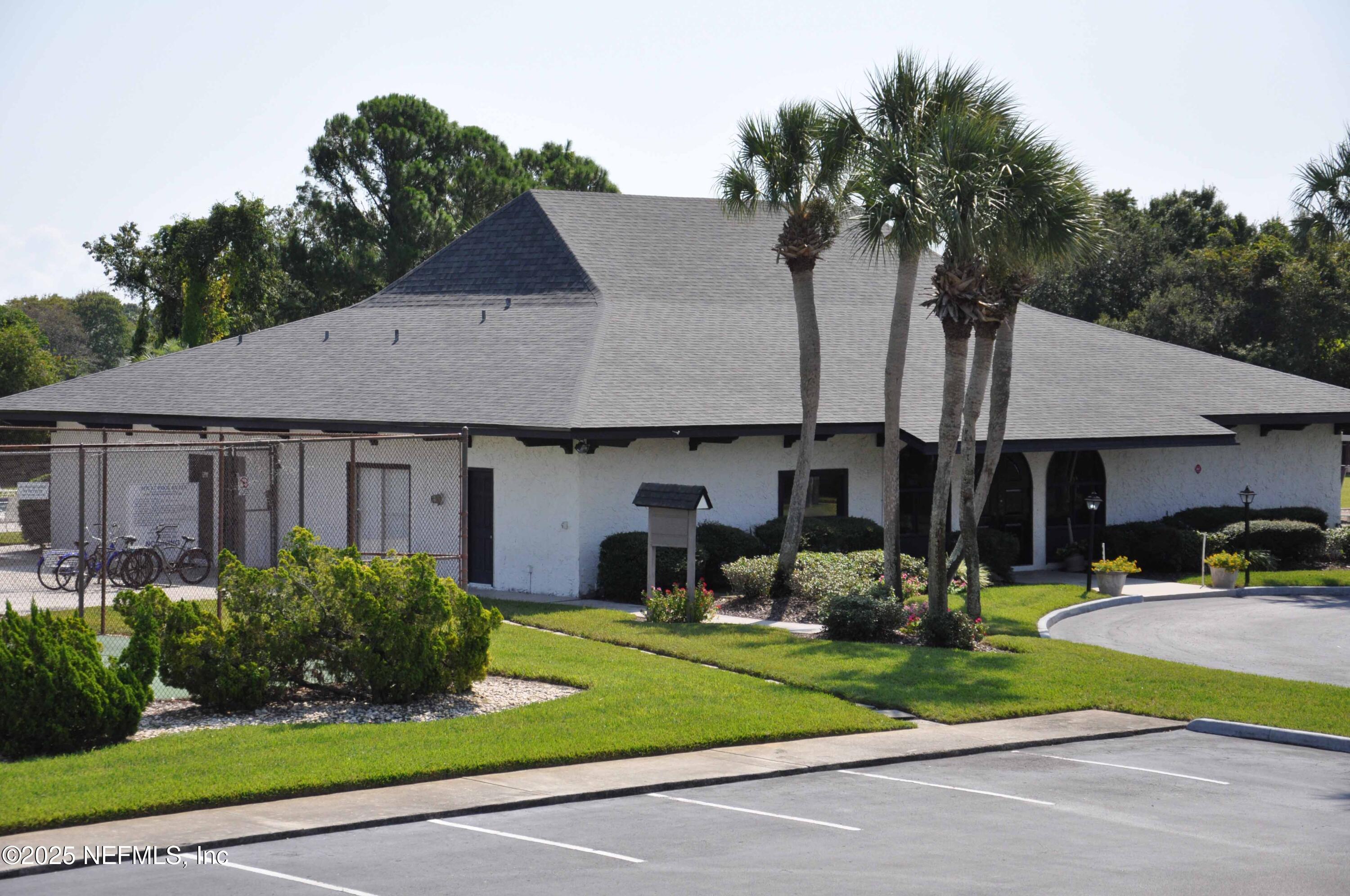 695 A1A North, Unit 23 Ponte Vedra Beach, FL 32082 - Photo 19 of 22 a house view with a garden space and street view