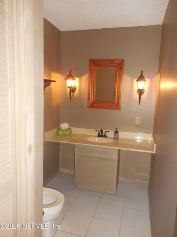 a bathroom with a sink and mirror