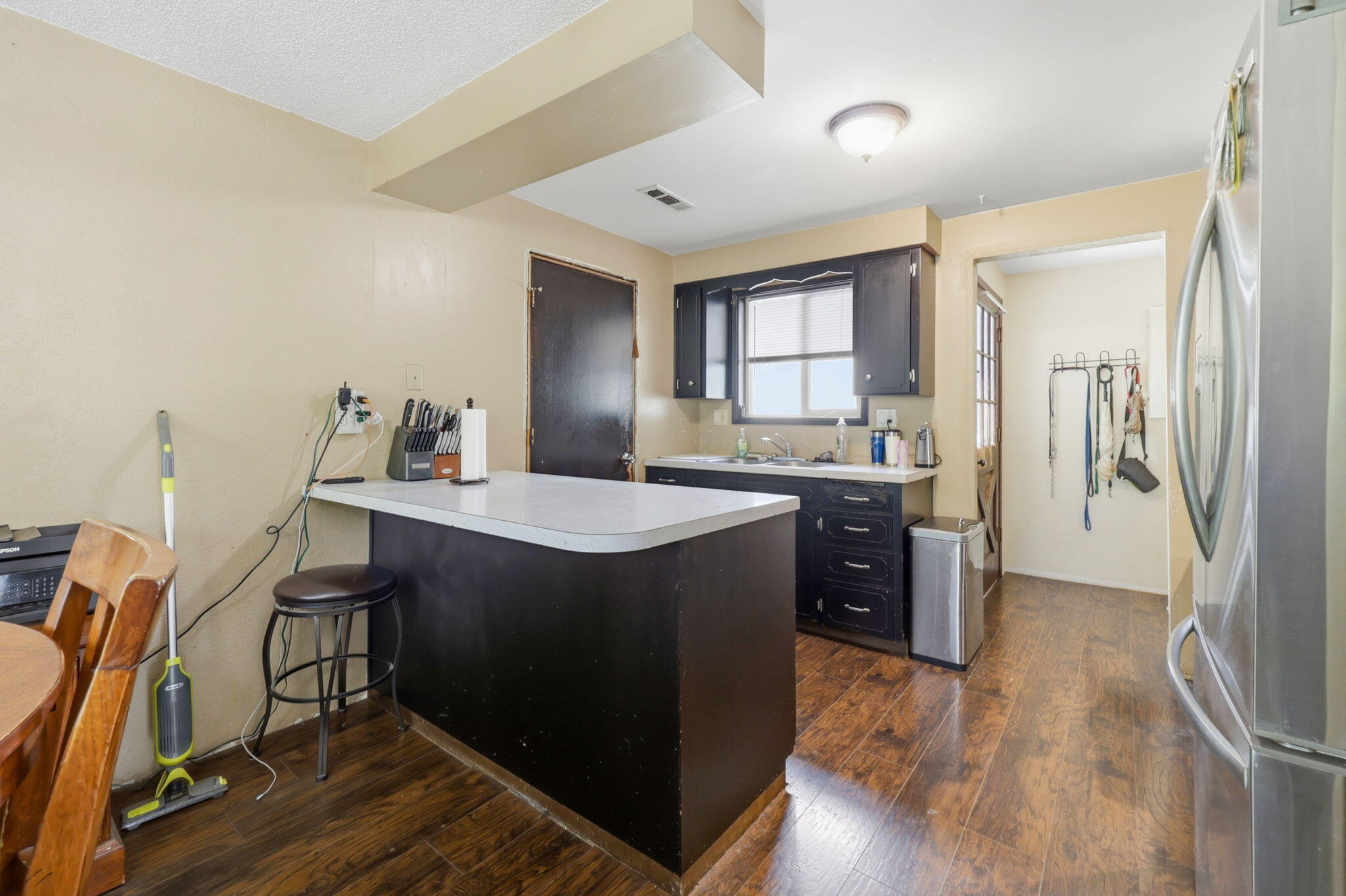 102 Elm Street Phoenix, OR 97535 - Photo 16 of 28 a kitchen with a refrigerator a sink dishwasher and a stove with wooden floor