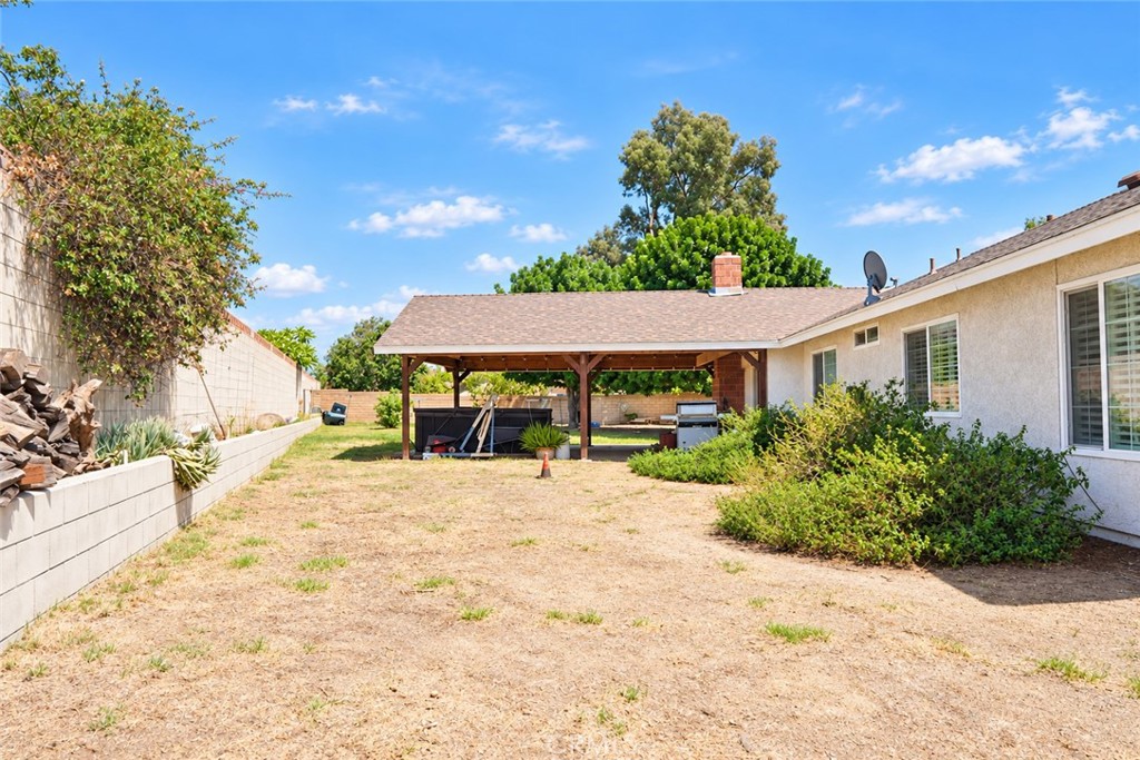 2164 North Date Avenue Rialto, CA 92377 - Photo 14 of 20 Covered rear patio overlooking the backyard with space to relax and entertain.