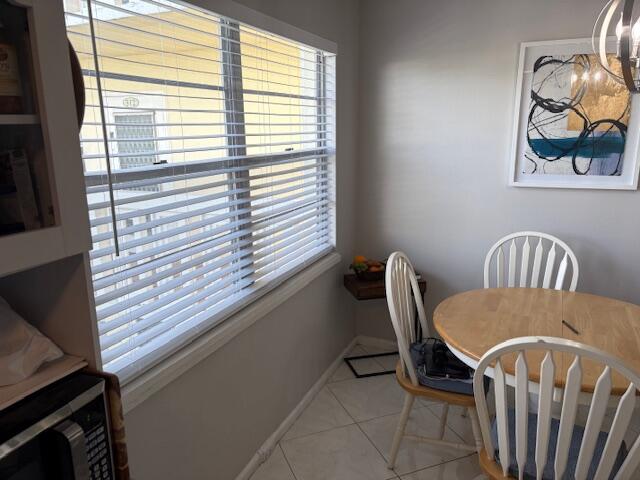 313 Dorset H, Unit 313 Boca Raton, FL 33434 - Photo 4 of 20 a view of a dining room with furniture and window