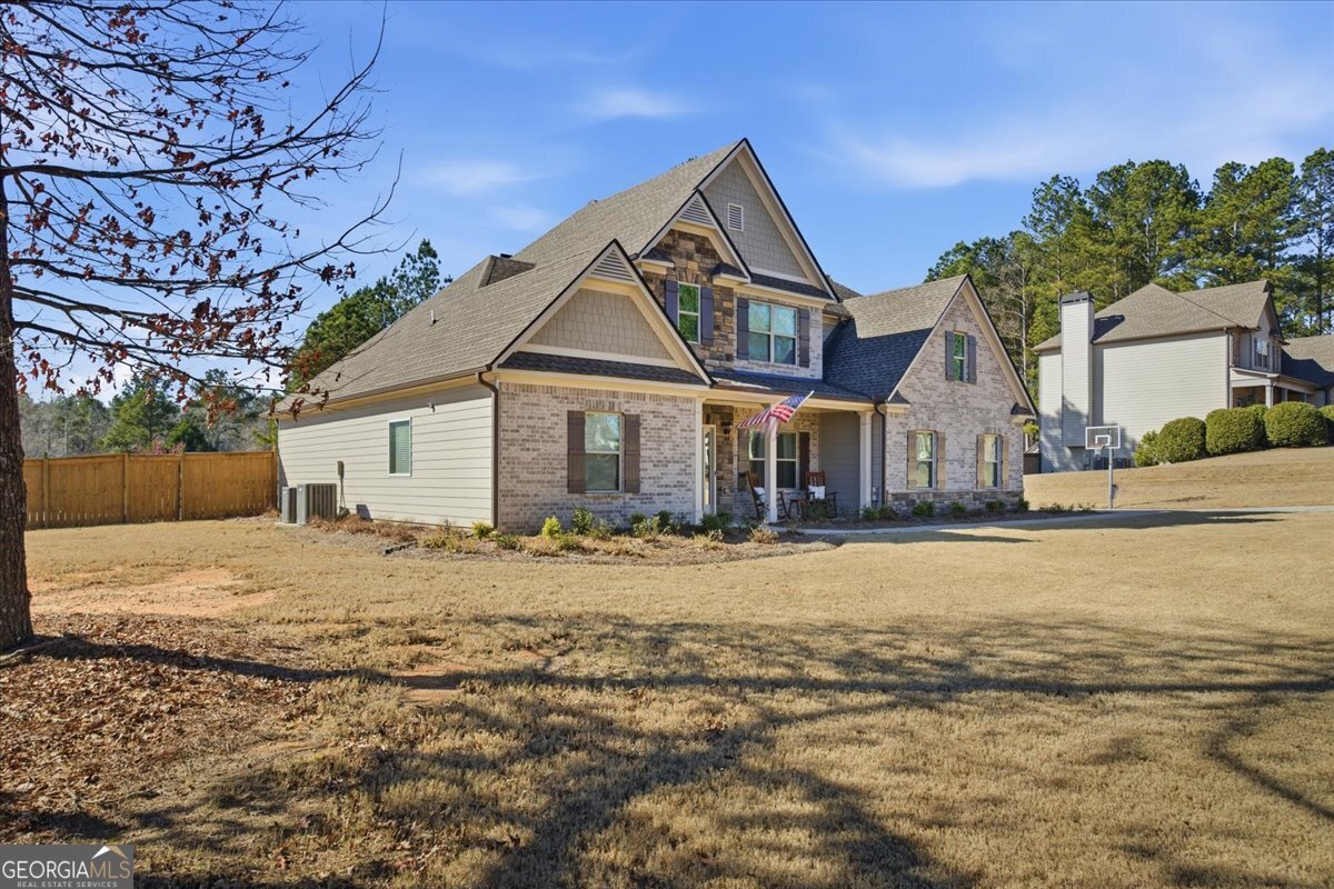 440 Creekside Park Covington, GA 30014 - Photo 36 of 57 a front view of a house with a yard