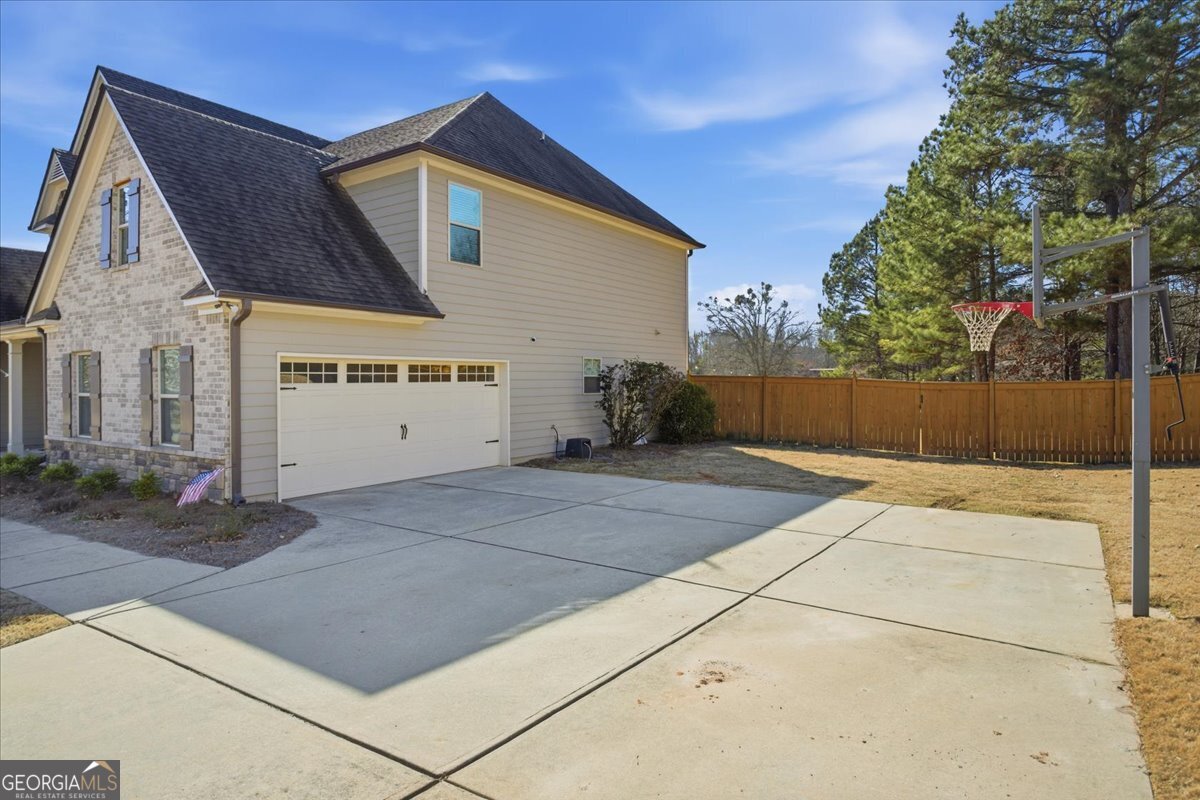 440 Creekside Park Covington, GA 30014 - Photo 38 of 57 a front view of a house with garage