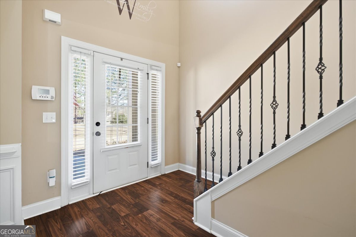 440 Creekside Park Covington, GA 30014 - Photo 4 of 57 a view of an entryway with wooden floor and door