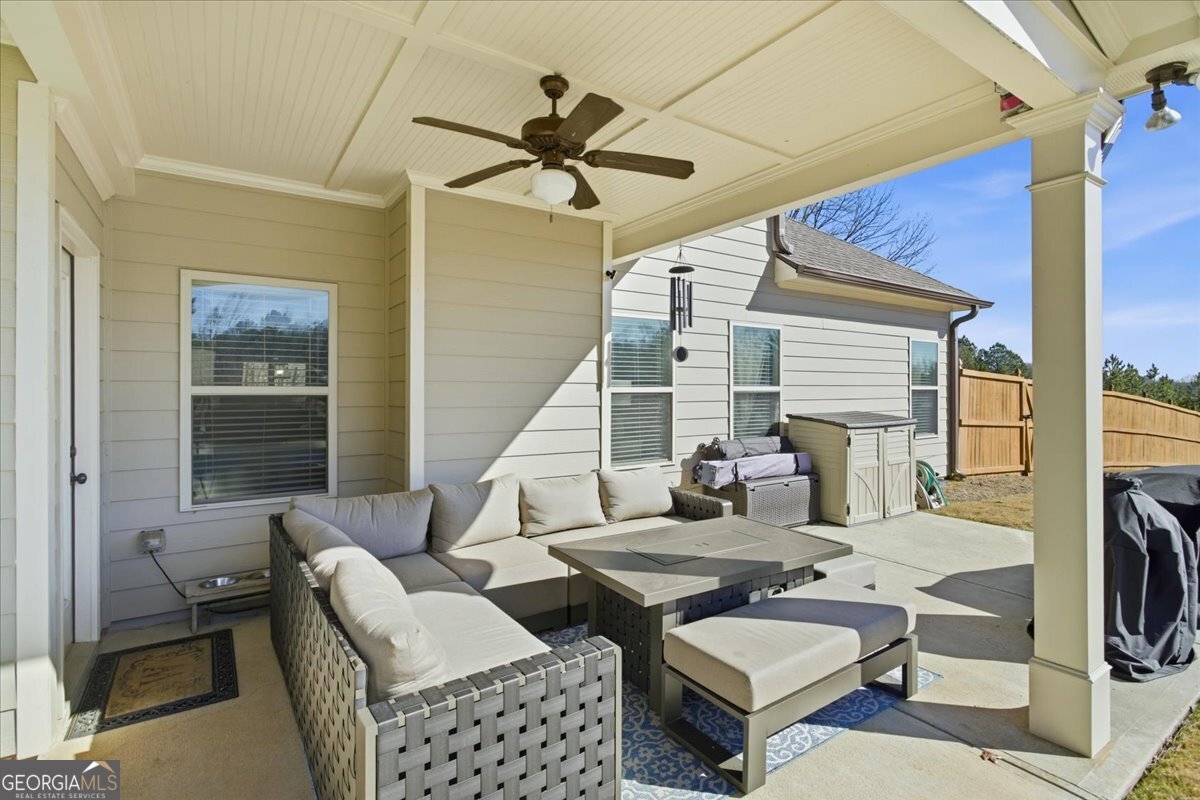 440 Creekside Park Covington, GA 30014 - Photo 45 of 57 a living room with furniture and a fireplace