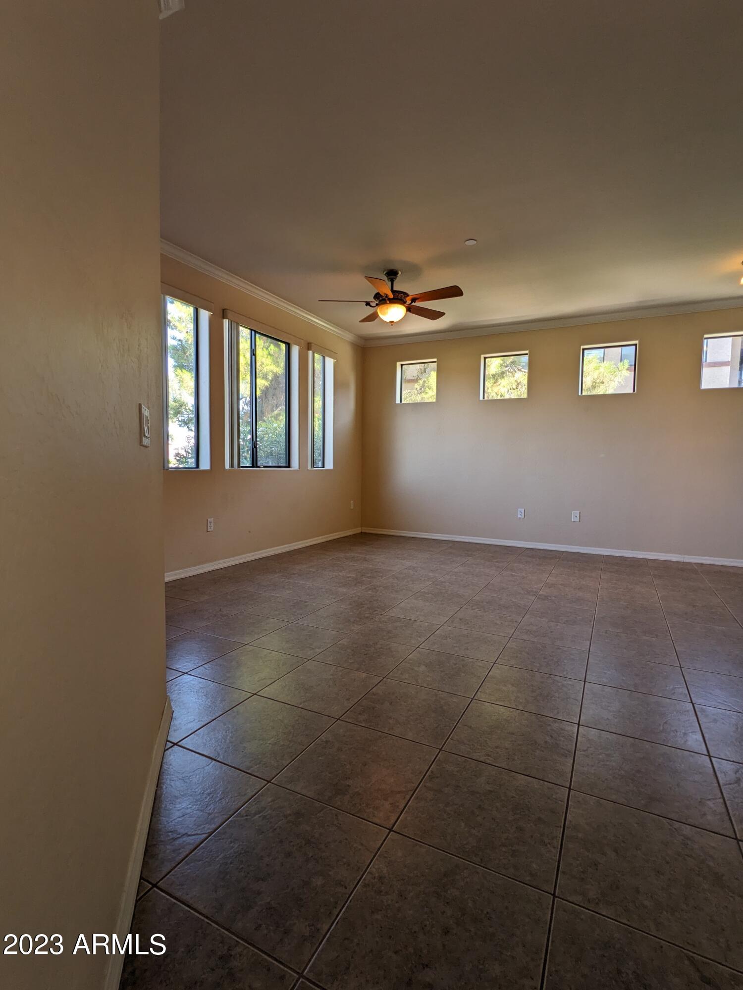 3330 South Gilbert Road, Unit 1007 Chandler, AZ 85286 - Photo 5 of 12 a view of an empty room with a window