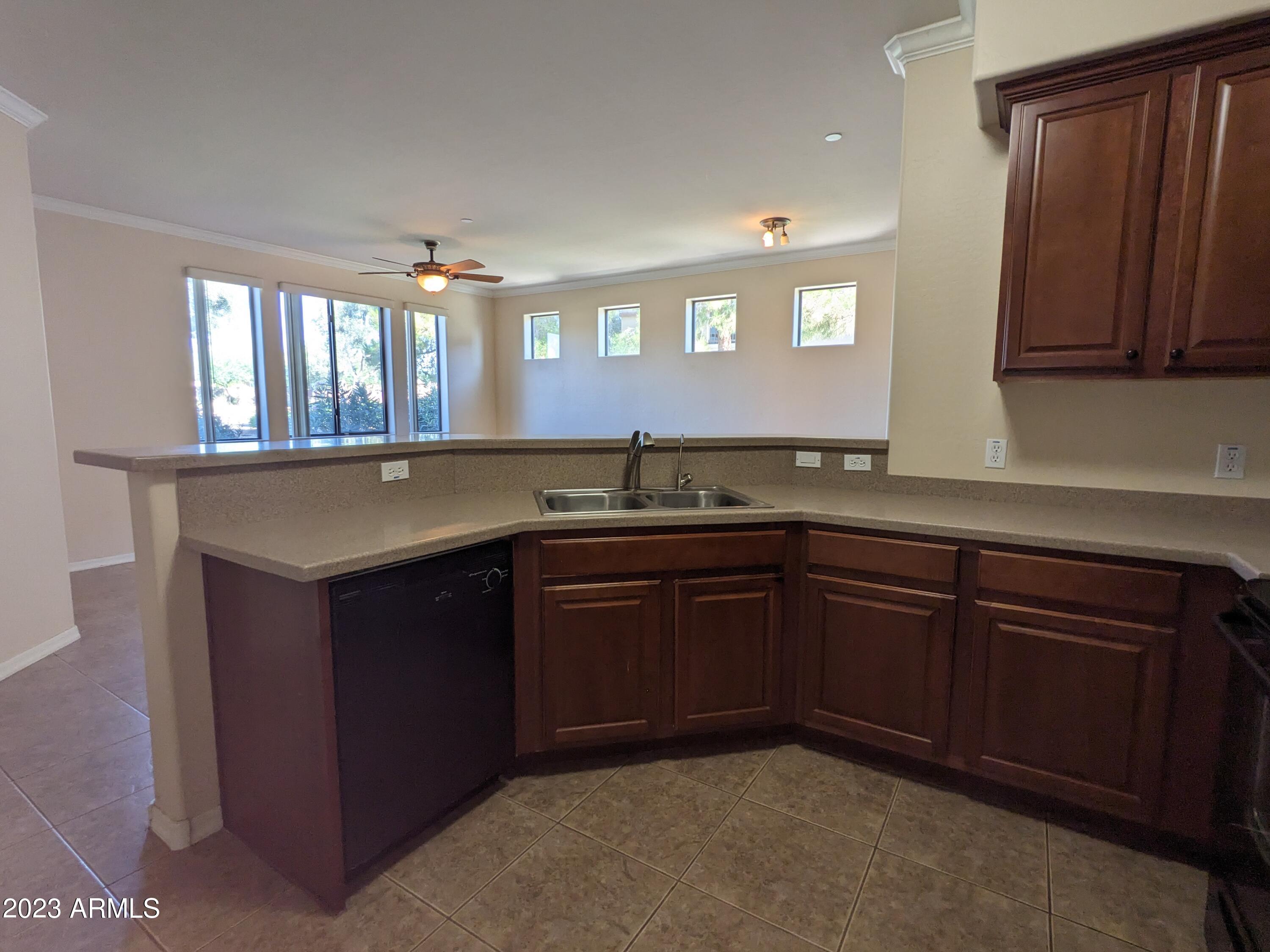 3330 South Gilbert Road, Unit 1007 Chandler, AZ 85286 - Photo 9 of 12 a kitchen with a sink and cabinets