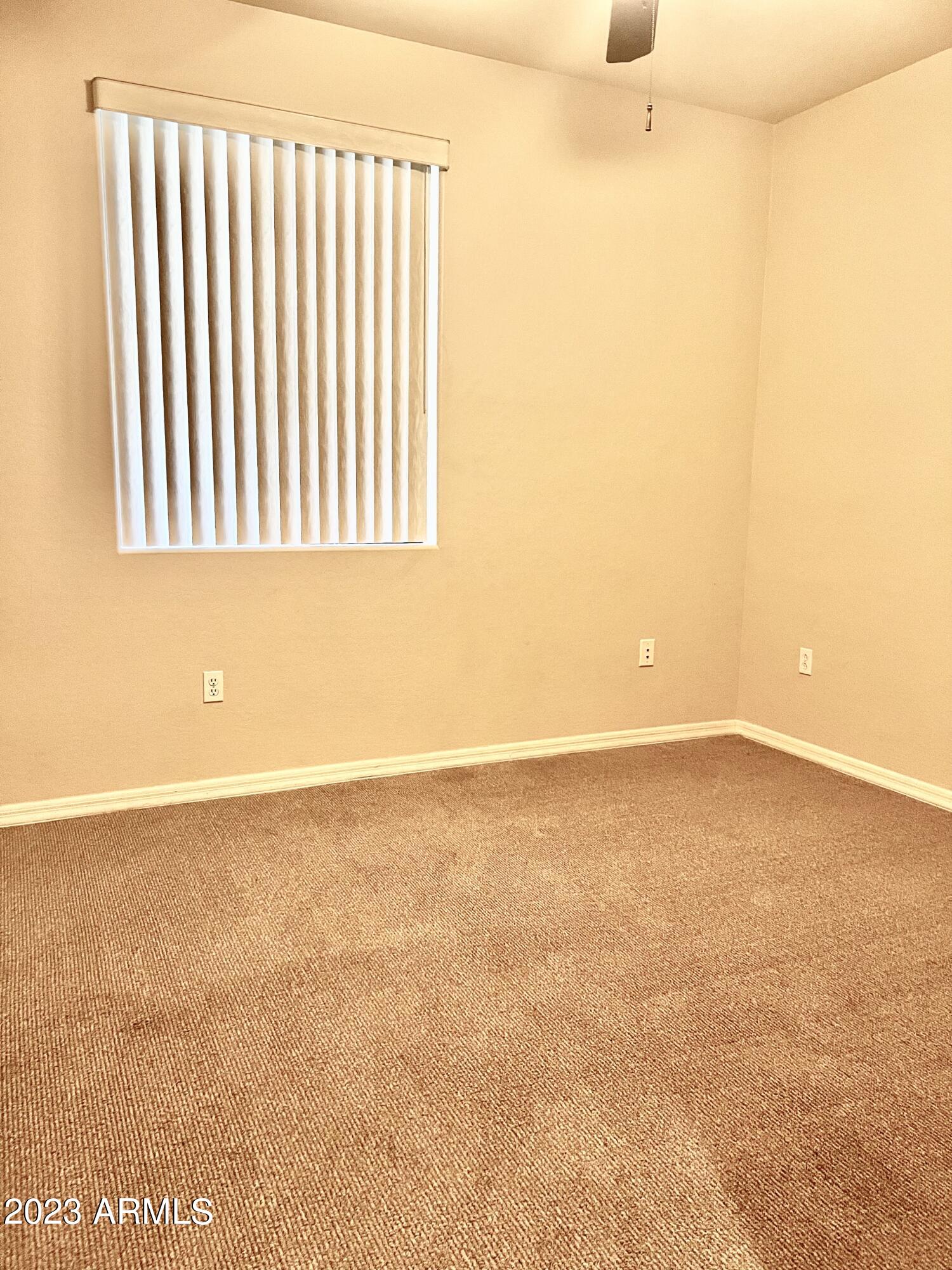 3330 South Gilbert Road, Unit 1007 Chandler, AZ 85286 - Photo 10 of 12 an empty room with wooden floor and windows