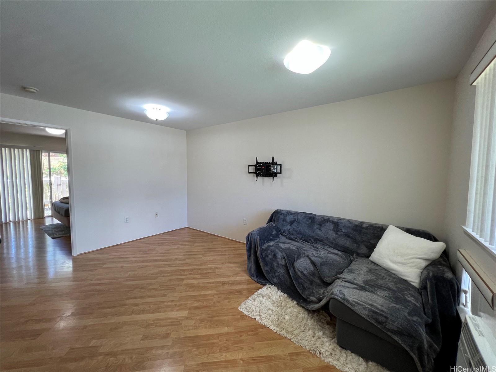 95-1145 Koolani Drive, Unit 100 Mililani, HI 96789 - Photo 5 of 9 a living room with furniture and couch