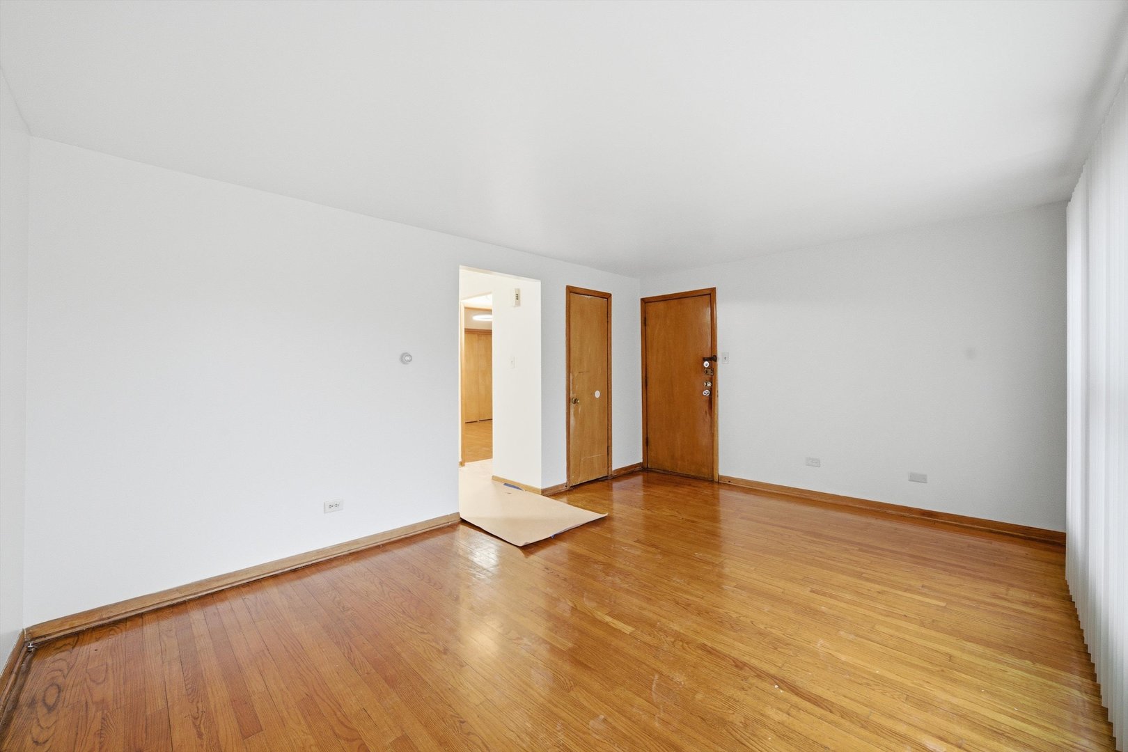 272 East 148th Street Harvey, IL 60426 - Photo 16 of 25 a view of an empty room with wooden floor