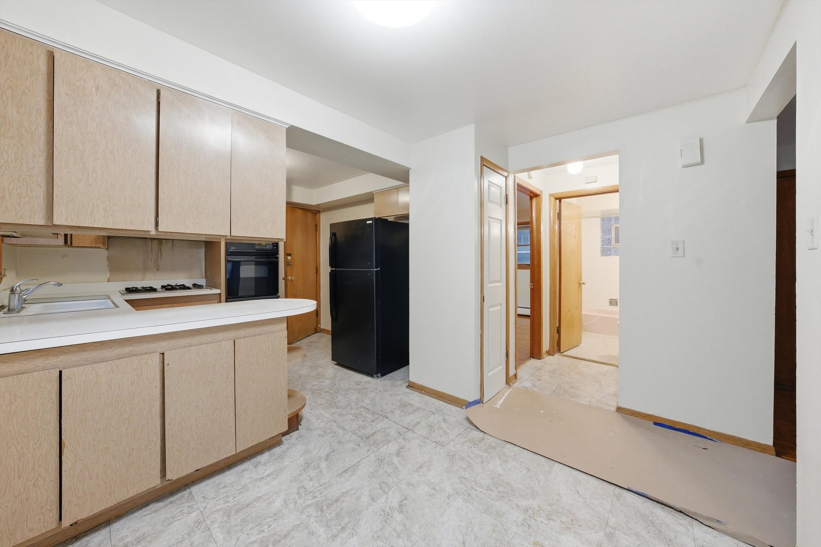 272 East 148th Street Harvey, IL 60426 - Photo 18 of 25 a kitchen with stainless steel appliances granite countertop a refrigerator and a sink