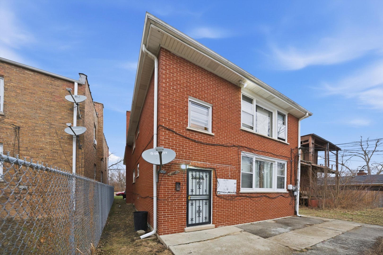 272 East 148th Street Harvey, IL 60426 - Photo 24 of 25 a front view of a house with a yard