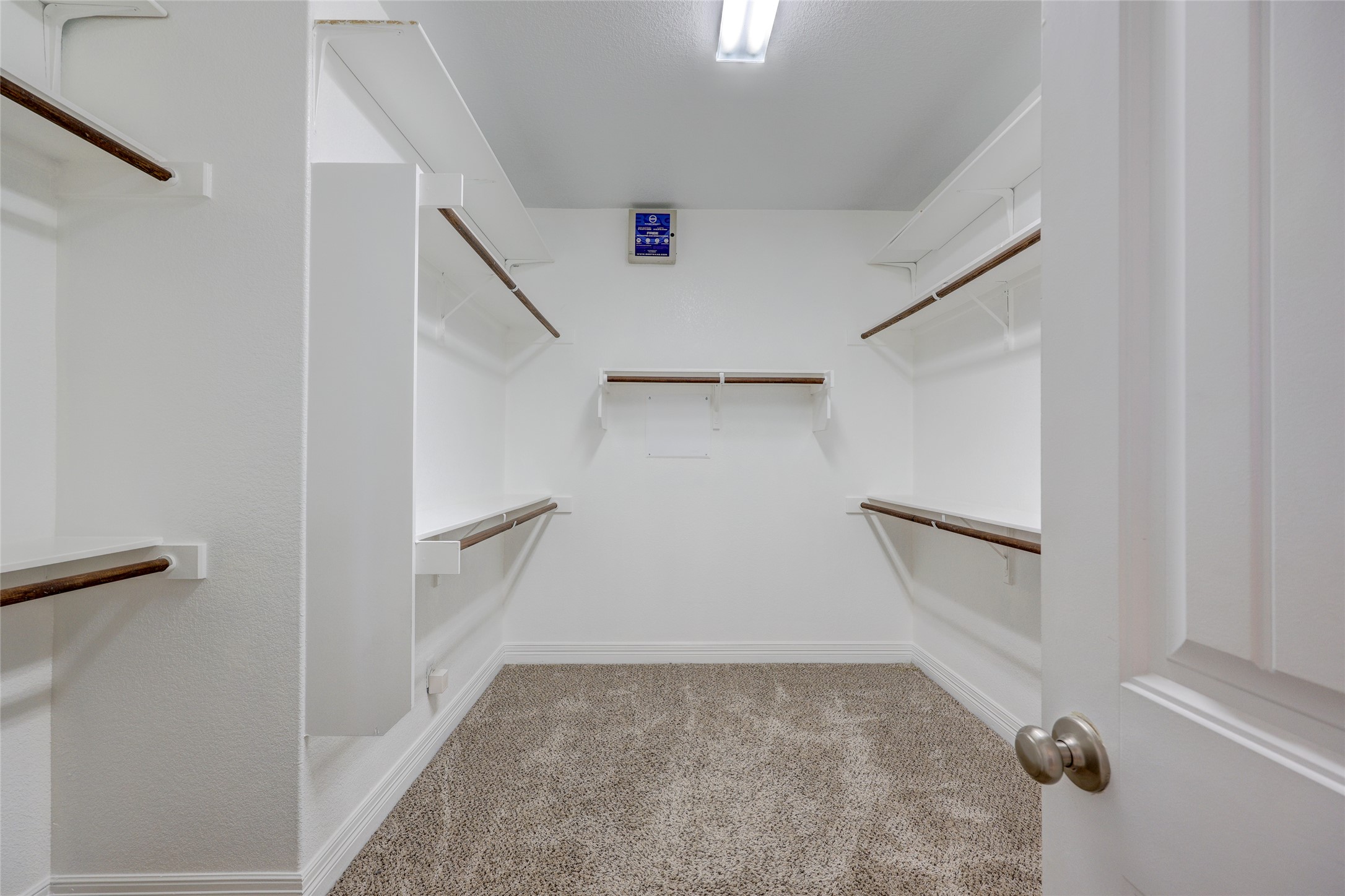 409 Betony Loop Buda, TX 78610 - Photo 22 of 38 Ample shelving and hanging space defines this well-appointed walk-in closet.