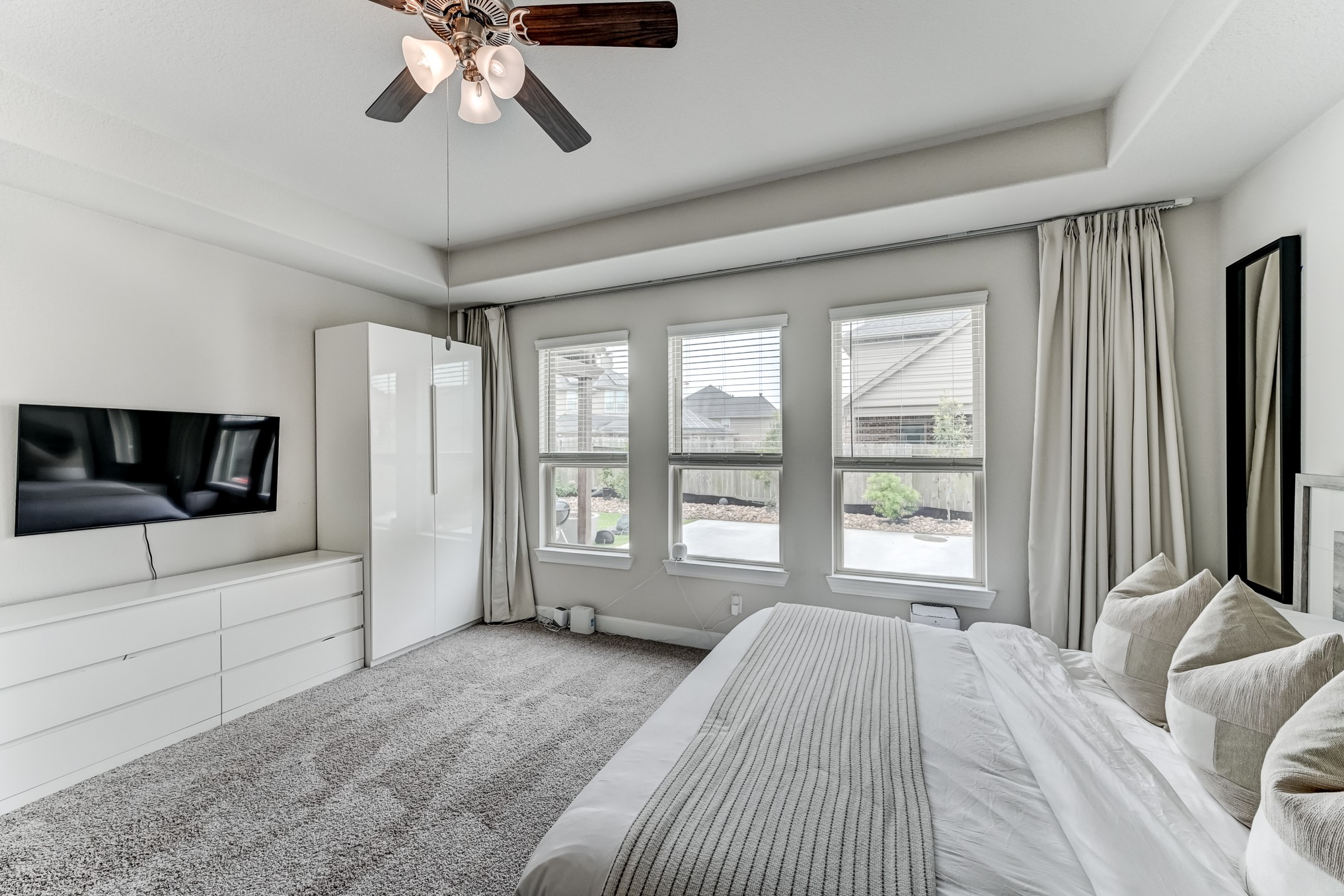 5806 Metaphor Way Rosenberg, TX 77469 - Photo 23 of 50 a bedroom with a bed and a flat screen tv