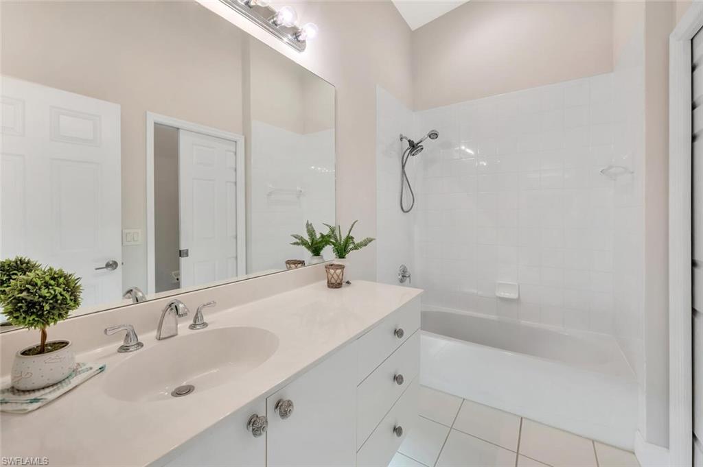 6720 Beach Resort Drive, Unit 10 Naples, FL 34114 - Photo 16 of 34 Full bathroom with vanity, bathing tub / shower combination, and tile patterned floors