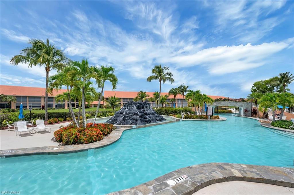 6720 Beach Resort Drive, Unit 10 Naples, FL 34114 - Photo 25 of 34 Community pool with a patio area