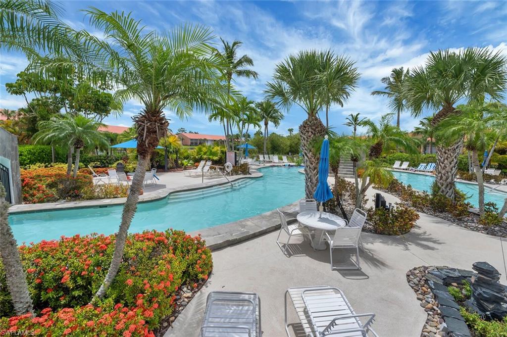 6720 Beach Resort Drive, Unit 10 Naples, FL 34114 - Photo 26 of 34 Community pool with a patio