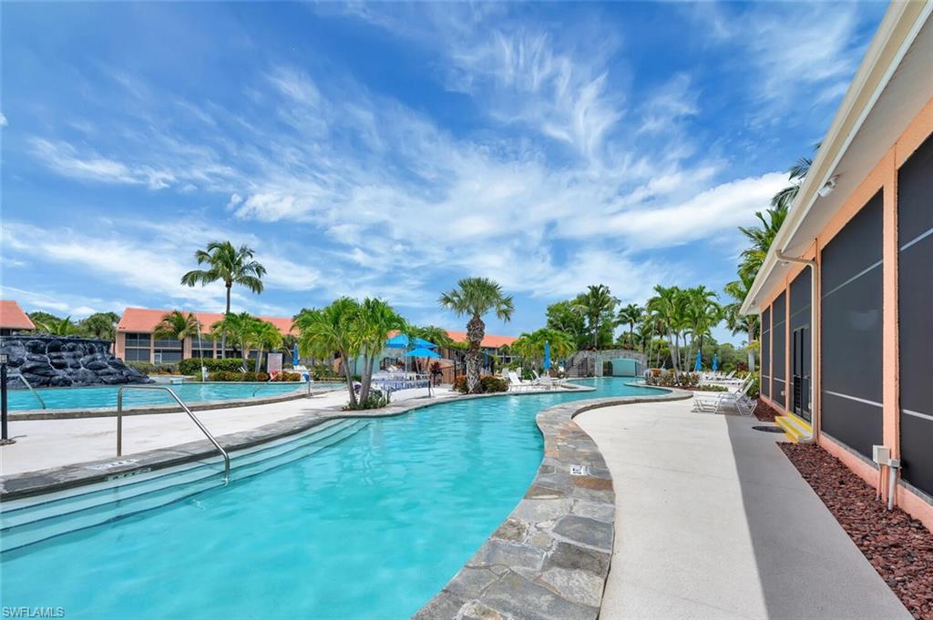 6720 Beach Resort Drive, Unit 10 Naples, FL 34114 - Photo 31 of 34 Community pool with a patio
