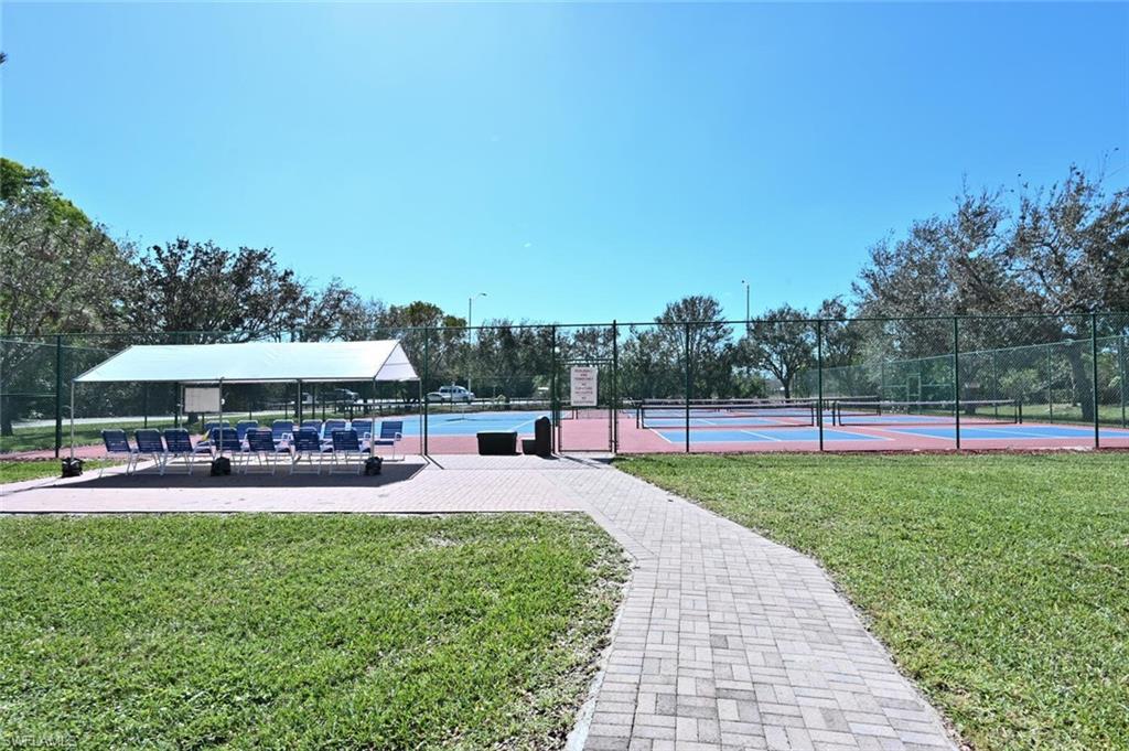 6720 Beach Resort Drive, Unit 10 Naples, FL 34114 - Photo 34 of 34 Surrounding community featuring a tennis court