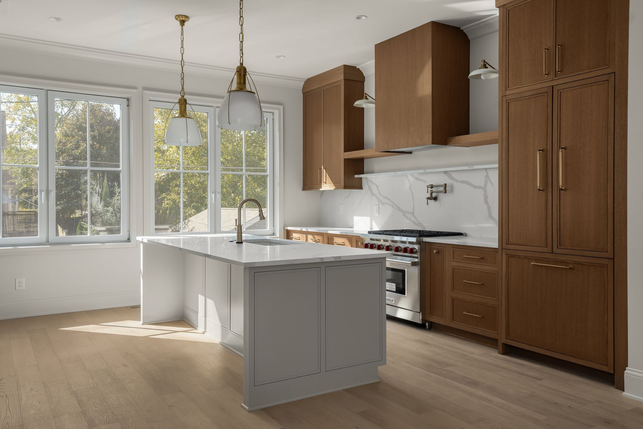 a kitchen with stainless steel appliances granite countertop a sink and a stove