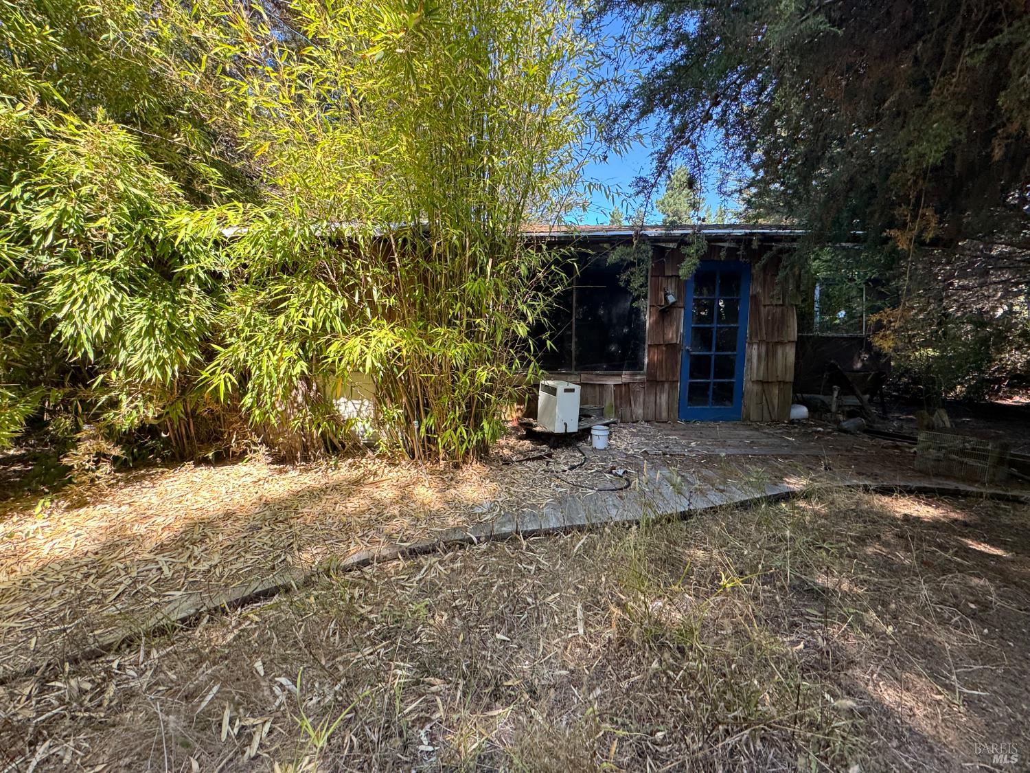 28270 Albion Ridge Road Albion, CA 95410 - Photo 15 of 22 a view of a patio with a table and chairs under an umbrella